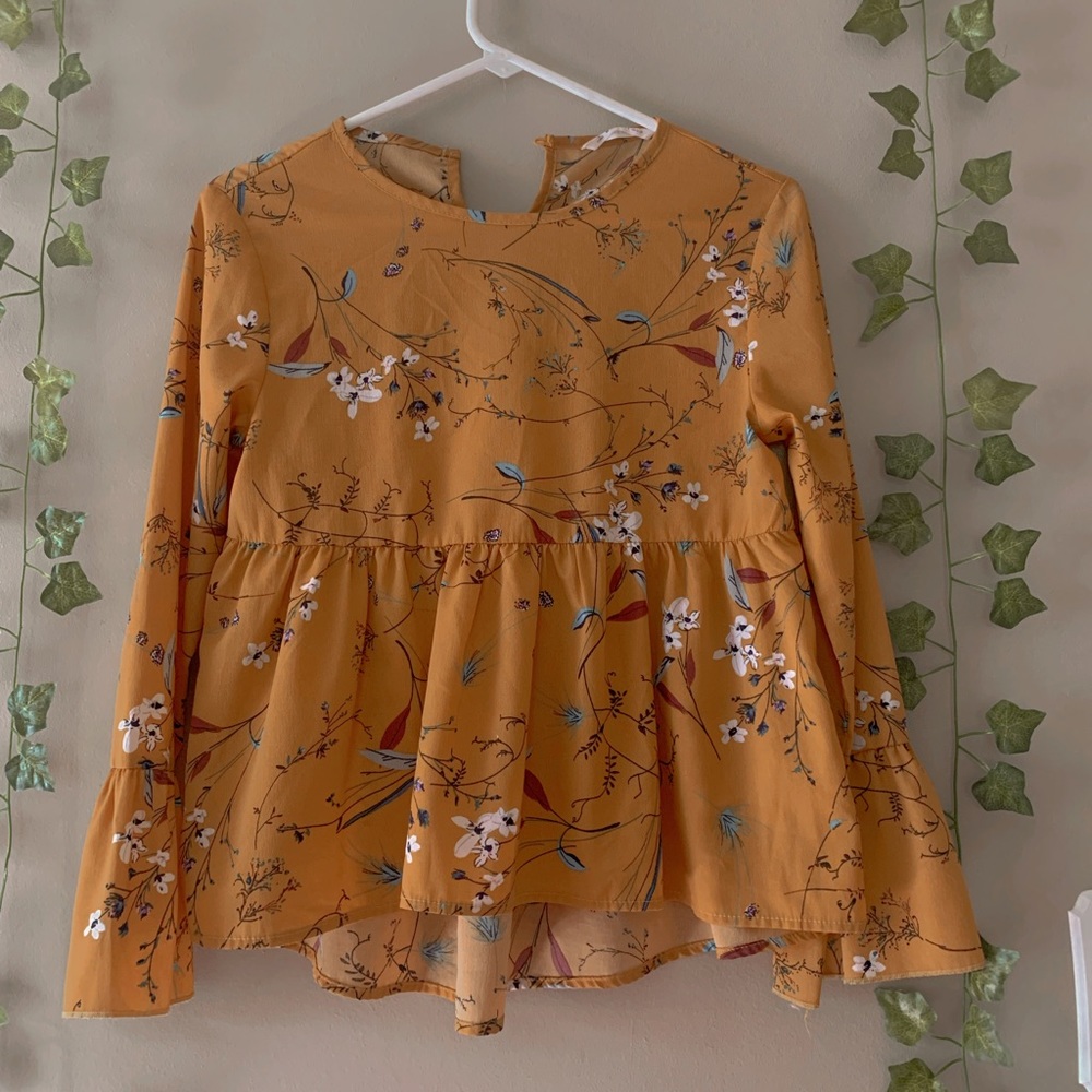 I am selling a peplum top long sleeve shirt.